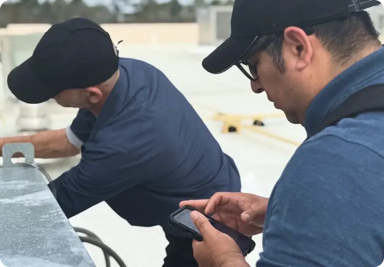 Two Technicians testing Tag Wizard - Asset Tagging App